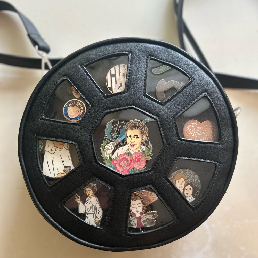 Black Round Crossbody Bag with Pin Display